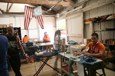 Levi's jeans makers worked in a room beside the pop-up shop to fashion customized styles.