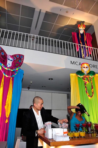 Event Creative placed masks atop colorful, billowing fabrics to reflect the event's Carnival theme.