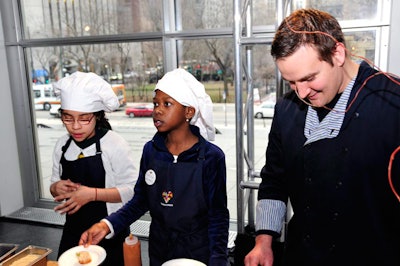 As guests arrived, 10-year-old chefs Danielle and Nicole handed out spring rolls, which they learned to make in the Common Threads classroom.