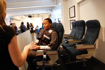 A set of airplane seats served as a prop for the story of one challenge participant.