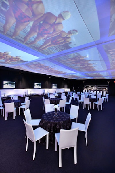 A starburst pattern decorated black linens under the tent at the grand opening.