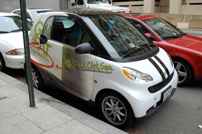 Event sponsor Goout2eat.com, a restaurant marketing site, branded a Smart Car parked near the entrance.