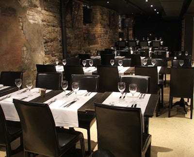 Renovated last spring, the private lounge at Six Steps Restaurant & Lounge mimics the look of the main-floor restaurant with exposed brick walls and dark wood furniture.
