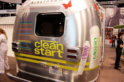 Reps for skincare company Dermalogica met with top clients in an Airstream stocked with water bottles, branded pens, and cushioned seating.