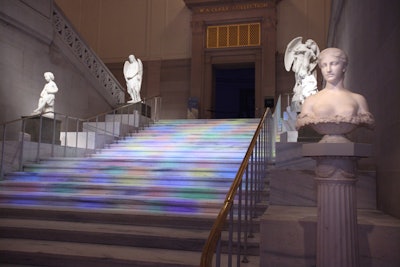 Light Olutions technicians lit the venue's main staircase, floor, and columns.