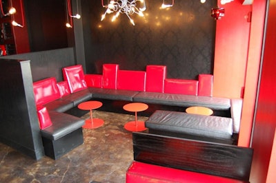Policy's ground-level restaurant and bar have black and red decor and ultra-modern lighting.