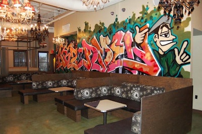 Chandeliers and graffiti-covered walls are focal points on the lounge level.