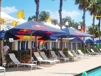 Red Bull rebranded the Doubletree Surfcomber's pool area with umbrellas, bars, and spandex on Thursday for the Evolve Pool Party.
