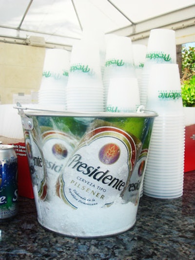 Presidente, the official beer sponsor at the Doubletree Surfcomber hotel, served its brews in branded buckets and plastic cups at the Evolve Pool Party on Thursday afternoon. The buckets and cups also lined the poolside bars.