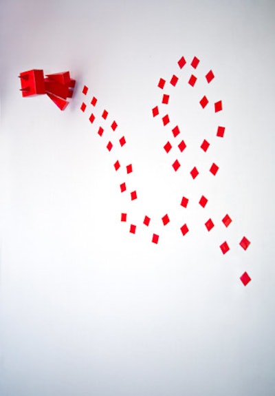 Students from Parsons, the New School for Design turned paint colors into whimsical robots, including a red one that streaked the shape of an AIDS ribbon on the wall.