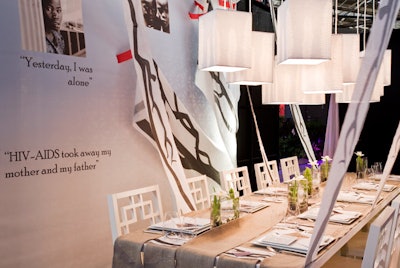 The dining area created by the designers from –Ful Studio drew attention to African AIDS orphans with statistics and inspirational messages on the tabletop and walls.