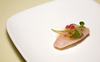 Scott Conant of Scarpetta served slices of raw yellowtail with sea salt.