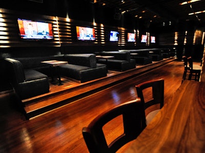 On the main level, each banquette sits beside a 50-inch plasma-screen TV.