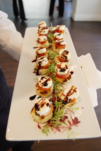 Servers passed hors d'oeuvres such as tomato and boccocini bites and couscous chicken cakes.