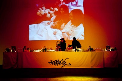 Video footage of Lennon and Ono screened on the walls above the bars in Baillie Court.