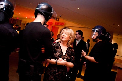 Volunteers dressed as riot police greeted guests at the entrance to Walker Court.