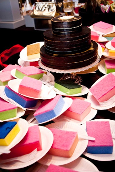 A tiered chocolate cake surrounded by foam sponges on paper plates was part of an interactive installation by Franco Mondini-Ruiz.