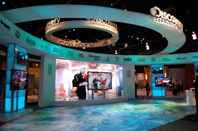Discovery Communications' high-tech circular booth featured a map projection on the floor.