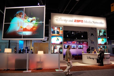 The Disney and ESPN Media Networks shared a booth with many monitors and several lounging areas.