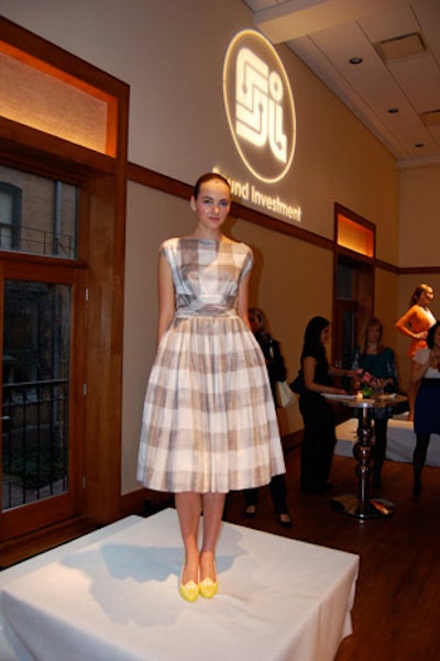 Throughout the Ivy Room, models stood on pedestals to showcase looks from the new Liz Claiborne collection.