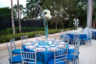Dinner tables surrounded the club's outdoor pool.