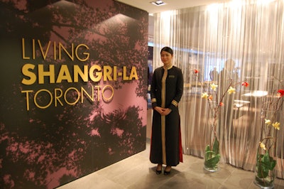 A greeter welcomed guests to the cocktail reception at the Shangri-La presentation centre.