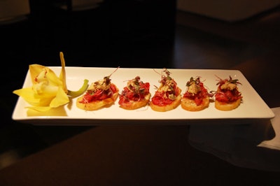 Servers passed hors d'oeuvres from Couture Cuisine & Event Artistry.