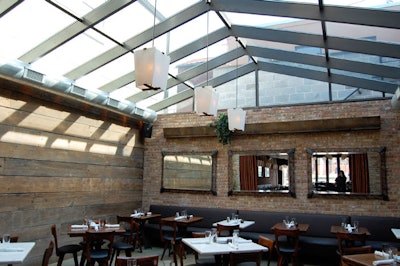 A sun-filled atrium seats 40 and can be curtained off for private events.
