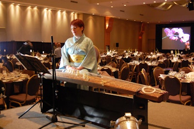 A musician played a Japanese koto harp during the cocktail reception.