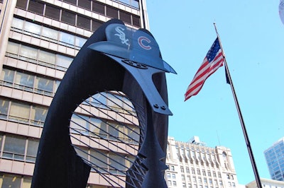 With the help of a boom lift, the Picasso statue was crowned with a hybrid White Sox-Cubs baseball cap.