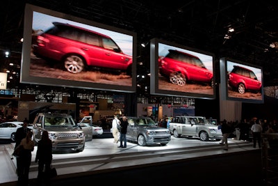 Hovering over its display models, Land Rover had television screens larger than the cars it was plugging.