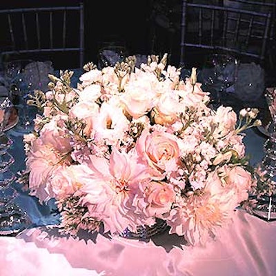 The all-white centerpieces were provided by Tansey Design Associates.