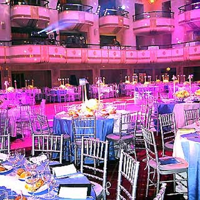 The ballroom was bathed in blue and purple lights.