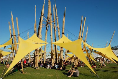 A towering art piece included yellow panels resembling boat sails, and a flame shot out of the top after the sun went down.