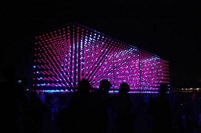 An art installation comprised of illuminated dots changed colors rhythmically.