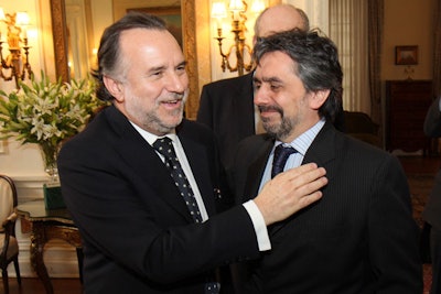 Departing ambassador Mariano Fernandez (left) greeted guests in the foyer.