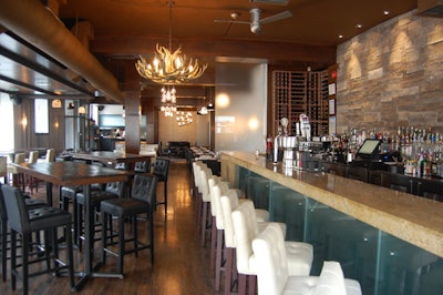 Vdara, decorated in cream and black with natural materials like granite and reclaimed wood, seats 104.