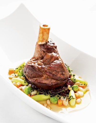 Entrée Scrimp: Braised lamb shank with red cabbage confit, cassoulet of white beans, and honey and thyme jus, $26 per person, from Design Cuisine