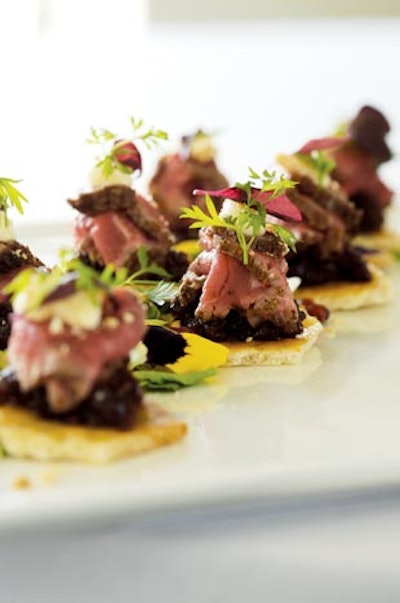 Hors D'oeuvres Splurge: Smoked beef tenderloin on almond-peppercorn flatbread with dried-cherry chutney and micro herbs, $2.75 per person, from Food for Thought in Chicago