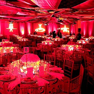 David Beahm transformed the Whitney's third floor gallery into a dining room, using tablecloths of fabric with Alexander Calder designs, gobos of Calder line drawings custom-made by Bentley Meeker, and yellow and red centerpieces.