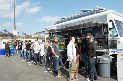 Lines formed for food from Kogi taco trucks.