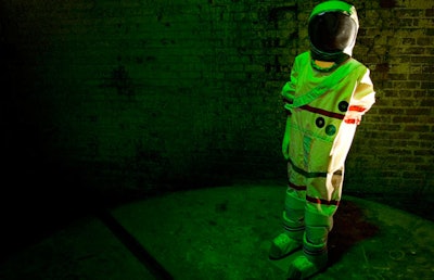 Spotlights shone on a space suit at the entrance to the Fermenting Cellar.