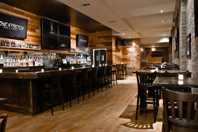 Behind the bar, four flat-screen TVs combine to form a screen that's more than 100 inches.