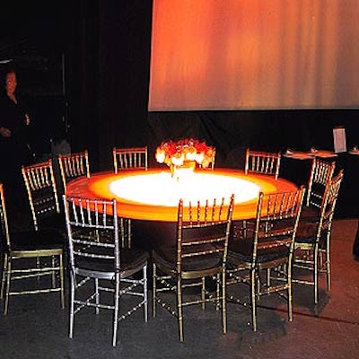 EventQuest's custom-made tables topped with opaque resin and lit from underneath added diffused, flattering light.