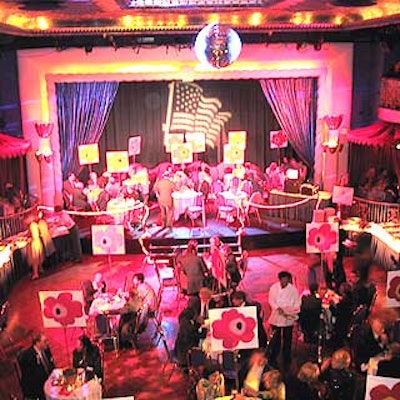 The main floor of the Supper Club was decorated with glowing pink lights and large pink daisies painted on white boards attached to clear Lucite sticks that were planted inside adobe flower pots filled with moss.