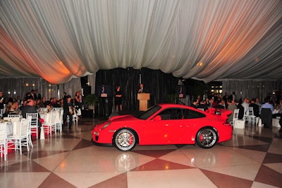 This red Porsche went for about $30,000 more than the sticker price at East Side House Settlement's auction. This is the event industry's version of 'calling the bottom,' no?