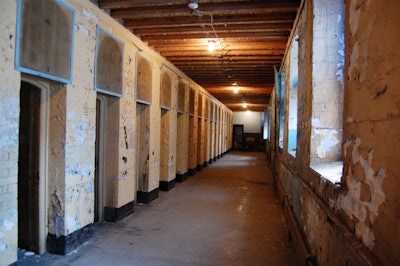 The hallway outside the cells served as a dayroom where prisoners spent one hour each day. The remaining 23 hours were spent in a 3- by 7-foot cell.