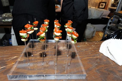 L-Eat Catering created hors d'oeuvres including bocconcini, tomato, and basil skewers.