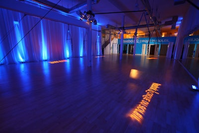 A solid wood laminate floor replaced the existing uneven cement floors previously in place at the space now used as the Reebok pop-up.