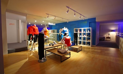 A showroom offers Reebok products on the upper level.